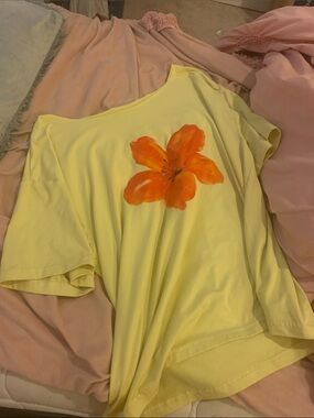 Yellow short sleeve off the shoulder summery top with orange flower
